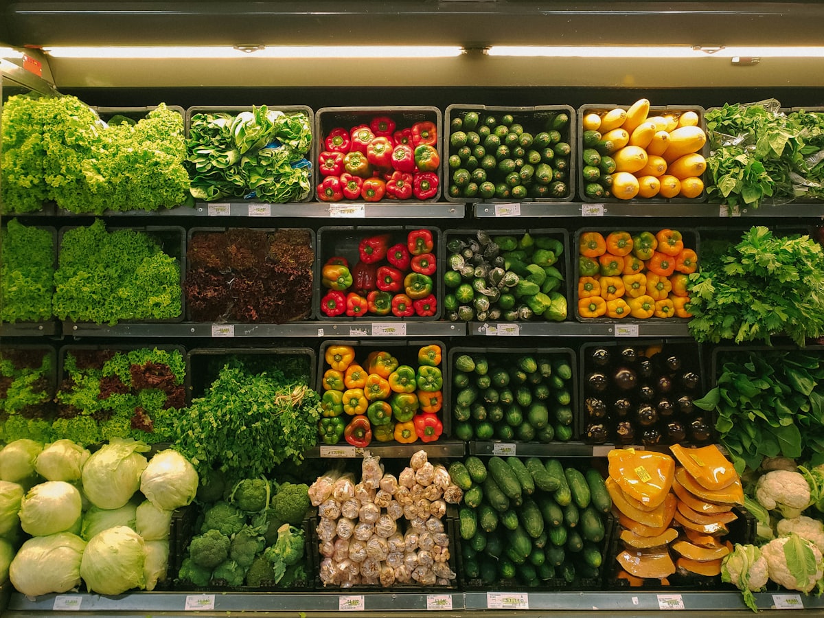 Fresh produce stacked on grocery shelves